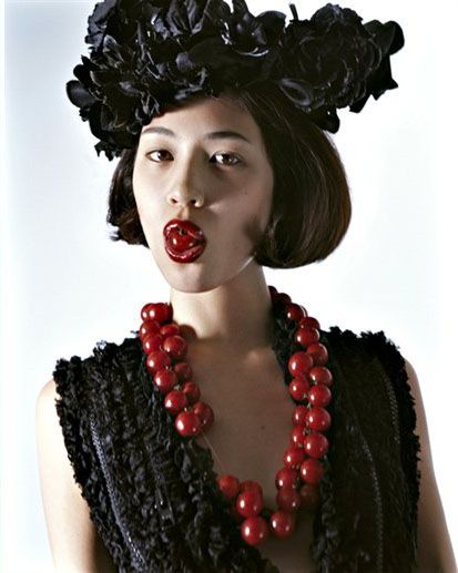 Kiko Mizuhara with fruit in the NYC Store's Holiday Campaign image of Kiko Mizuhara with fruit in the NYC Store's Holiday Campaign